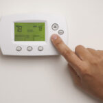 Male Hand On Digital Thermostat Set At 78 Degrees Dakota Electric