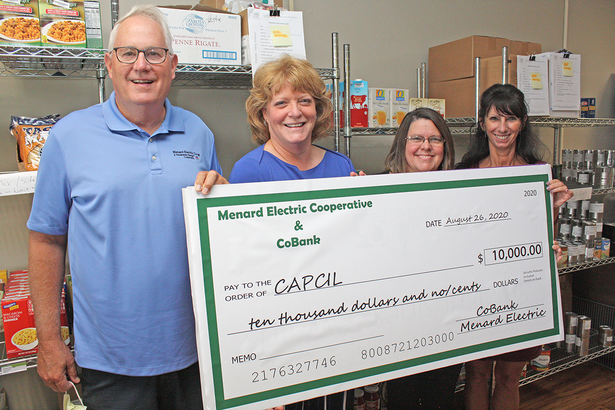 Menard Electric Cooperative Sharing Success Donation To CAPCIL